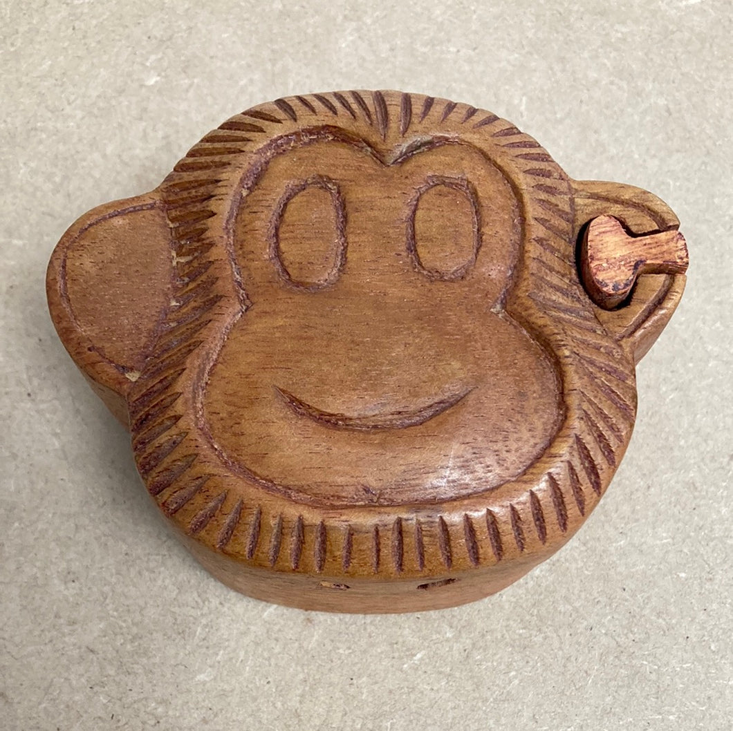 Boîte à puzzle visage de singe