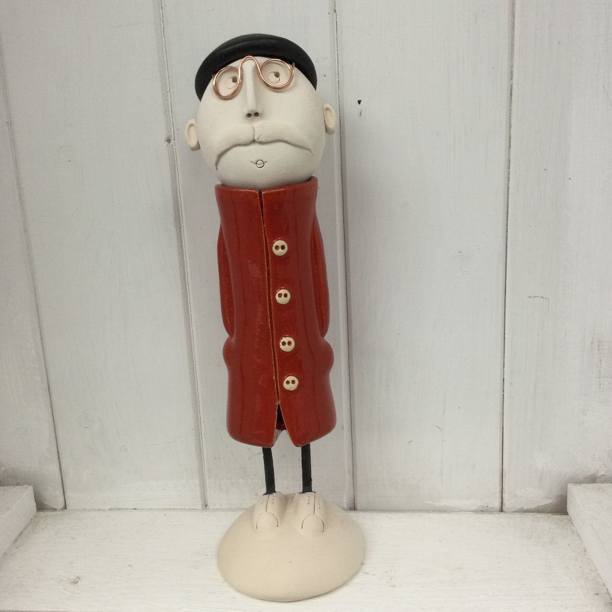 Ceramic Man with moustache, beret and a red coat