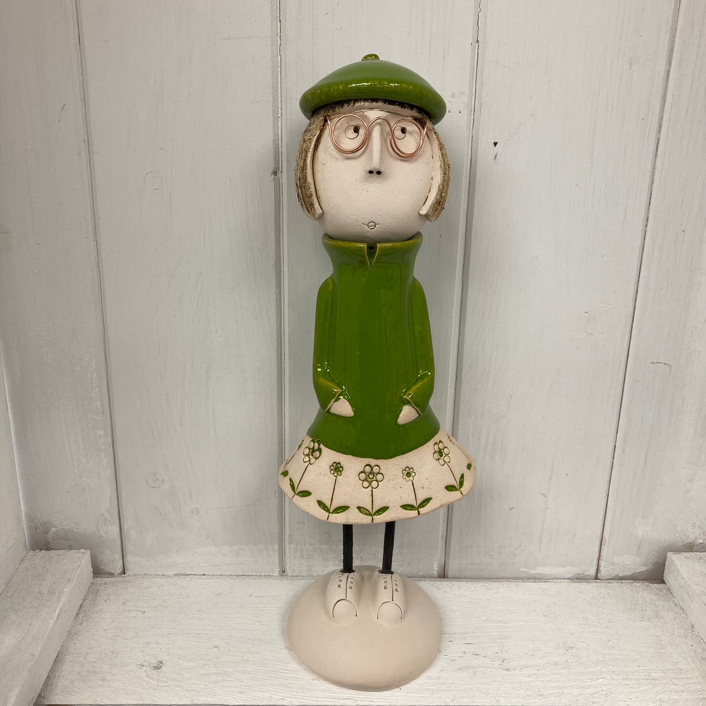 Ceramic Girl with a short Bob in a green dress