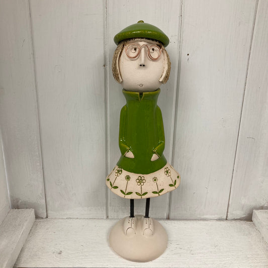 Ceramic Girl with a short Bob in a green dress